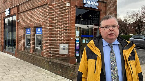 Picture of Councillor Waller standing outside Acomb Halifax Bank