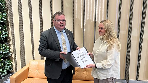 Andrew Waller handing in his petition to the Regional Public Affairs Manager at the Halifax offices in Leeds