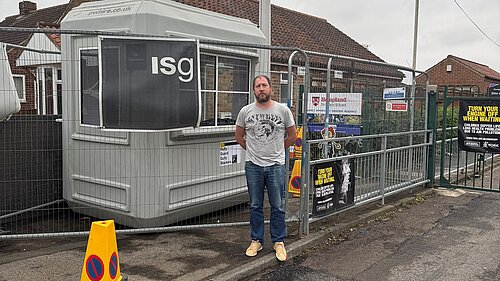 Nigel Ayre standing by Hempland primary school